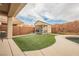 Large shed and turf area with brick wall for a low maintenance, private space at 47 Desert Sunflower Cir, Henderson, NV 89002