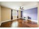 Bedroom featuring hardwood floors, ceiling fan, a desk, and a window with blinds at 47 Desert Sunflower Cir, Henderson, NV 89002