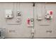 Side view of multiple electrical panels and meters on the exterior of the home at 47 Desert Sunflower Cir, Henderson, NV 89002