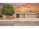 Charming single-story home boasts a tile roof, desert landscaping, and a spacious three-car garage at 47 Desert Sunflower Cir, Henderson, NV 89002