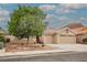 Charming single-story home boasts a tile roof, desert landscaping, and a spacious three-car garage at 47 Desert Sunflower Cir, Henderson, NV 89002