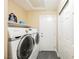 Laundry room featuring a washer and dryer set with folding shelf above at 47 Desert Sunflower Cir, Henderson, NV 89002