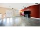 Open living room with tile floors, a ceiling fan, large television, and French doors at 47 Desert Sunflower Cir, Henderson, NV 89002