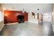 Open living room with tile floors, a ceiling fan, large television, and neutral color scheme at 47 Desert Sunflower Cir, Henderson, NV 89002