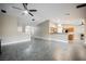 Open-concept living area with tile floors, modern lighting, and access to the adjacent kitchen at 47 Desert Sunflower Cir, Henderson, NV 89002