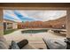 Backyard swimming pool featuring built-in spa, patio seating, and a mountain view at 47 Desert Sunflower Cir, Henderson, NV 89002