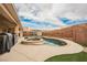 Sparkling pool with a built-in jacuzzi and lush landscaping, perfect for relaxation and entertainment at 47 Desert Sunflower Cir, Henderson, NV 89002