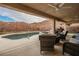 Wonderful pool and spa with patio furniture and a desert mountain backdrop at 47 Desert Sunflower Cir, Henderson, NV 89002