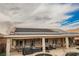 View of the backyard featuring the pool, covered patio, and solar panels on the roof at 47 Desert Sunflower Cir, Henderson, NV 89002