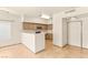 Bright kitchen with a breakfast bar, neutral cabinets, and modern appliances at 4830 Grey Wolf Ln # 104, Las Vegas, NV 89149