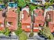 Stunning aerial view of homes with red tile roofs, lush landscaping, and private pools in a serene neighborhood setting at 5123 Southern Hills Ln, Las Vegas, NV 89113