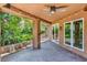 Inviting covered patio with paver flooring offering views of the lush backyard at 5123 Southern Hills Ln, Las Vegas, NV 89113