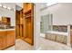 Bathroom featuring a walk-in closet, vanity with granite countertop and a glass-enclosed shower with tub at 5123 Southern Hills Ln, Las Vegas, NV 89113