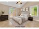 This virtually staged bedroom features a ceiling fan, and views of the backyard at 5123 Southern Hills Ln, Las Vegas, NV 89113