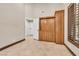 Neutral bedroom showcasing built-in wooden storage and tiled flooring at 5123 Southern Hills Ln, Las Vegas, NV 89113