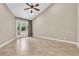 Bedroom showing tile flooring and glass doors with access to a private garden at 5123 Southern Hills Ln, Las Vegas, NV 89113