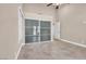 Bedroom featuring tile flooring, ceiling fan, a large closet, neutral walls, and ensuite bathroom access at 5123 Southern Hills Ln, Las Vegas, NV 89113