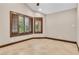 Bright bedroom featuring tan-colored walls and shutters on the windows at 5123 Southern Hills Ln, Las Vegas, NV 89113