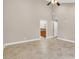 Spacious bedroom showing neutral color palette, tile flooring, and large doorway leading to ensuite bathroom at 5123 Southern Hills Ln, Las Vegas, NV 89113