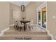 Staged dining room featuring natural light from patio doors perfect for entertaining at 5123 Southern Hills Ln, Las Vegas, NV 89113