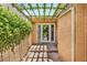 Covered garden entryway into home, featuring lush greenery and shade at 5123 Southern Hills Ln, Las Vegas, NV 89113