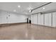 Spacious garage with epoxy flooring and abundant white built-in storage at 5123 Southern Hills Ln, Las Vegas, NV 89113