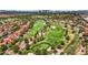 Beautiful aerial view of a meticulously manicured golf course surrounded by residential homes and lush landscaping at 5123 Southern Hills Ln, Las Vegas, NV 89113