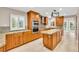 Bright kitchen with custom cabinetry, granite countertops, and stainless steel appliances at 5123 Southern Hills Ln, Las Vegas, NV 89113
