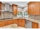 Well-lit kitchen with granite countertops, stainless steel appliances, and ample cabinet space at 5123 Southern Hills Ln, Las Vegas, NV 89113