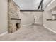 Open living room featuring a stone fireplace and beamed ceilings perfect for modern comfort at 5123 Southern Hills Ln, Las Vegas, NV 89113