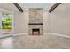 Cozy living room featuring a stone fireplace and access to the yard perfect for relaxation at 5123 Southern Hills Ln, Las Vegas, NV 89113