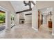 Inviting living room showcasing a stone fireplace and natural light from the patio doors at 5123 Southern Hills Ln, Las Vegas, NV 89113
