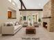 Virtually staged living room with a striking stone fireplace and vaulted ceilings at 5123 Southern Hills Ln, Las Vegas, NV 89113