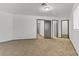 Bright bedroom with plush carpeting, multiple doors, and large window, offering ample natural light at 538 Kristin Ln, Henderson, NV 89011