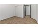 Cozy bedroom with neutral carpeting, a large sliding-door closet, and an adjacent door at 538 Kristin Ln, Henderson, NV 89011