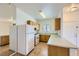 Well-lit kitchen featuring white appliances and ample counter space at 5650 E Sahara Ave # 1001, Las Vegas, NV 89142