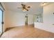 Open concept living area with neutral walls, tiled floors, and a ceiling fan at 5650 E Sahara Ave # 1001, Las Vegas, NV 89142
