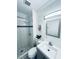 Bright bathroom with a walk-in shower and modern vanity at 5821 Marka Dr, Las Vegas, NV 89108