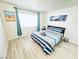 Calming bedroom with a large window, cool-toned art, and plenty of space at 5821 Marka Dr, Las Vegas, NV 89108