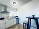 Efficient kitchen with bright cabinets and counter space, perfect for small meals at 5821 Marka Dr, Las Vegas, NV 89108