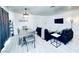 Comfortable living room area features a dining table and a mounted TV at 5821 Marka Dr, Las Vegas, NV 89108