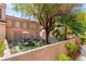 Backyard with artificial turf, patio furniture, and a charming desert landscape at 68 Belle Soleil Ave, Las Vegas, NV 89123