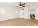Bedroom with wood-look flooring, modern fan, and access to bonus room at 68 Belle Soleil Ave, Las Vegas, NV 89123