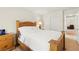 Bedroom with wooden bed frame, closet, and hallway access for comfortable living at 68 Belle Soleil Ave, Las Vegas, NV 89123