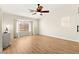 Spacious bedroom with wood-look floors, a ceiling fan, and natural light at 68 Belle Soleil Ave, Las Vegas, NV 89123