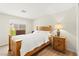 Cozy bedroom with hardwood floors, wooden bed frame, natural light, and warm, inviting ambiance at 68 Belle Soleil Ave, Las Vegas, NV 89123