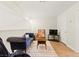 Bonus room featuring a plush blue velvet chaise lounge and modern decor at 68 Belle Soleil Ave, Las Vegas, NV 89123