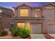 Charming two-story townhome with an attached garage and well-maintained landscaping at 68 Belle Soleil Ave, Las Vegas, NV 89123