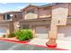 Charming two-story townhome with an attached garage and well-maintained landscaping at 68 Belle Soleil Ave, Las Vegas, NV 89123