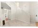 Bright foyer features soaring ceilings, neutral paint, tile flooring, and a stylish pendant light fixture at 68 Belle Soleil Ave, Las Vegas, NV 89123